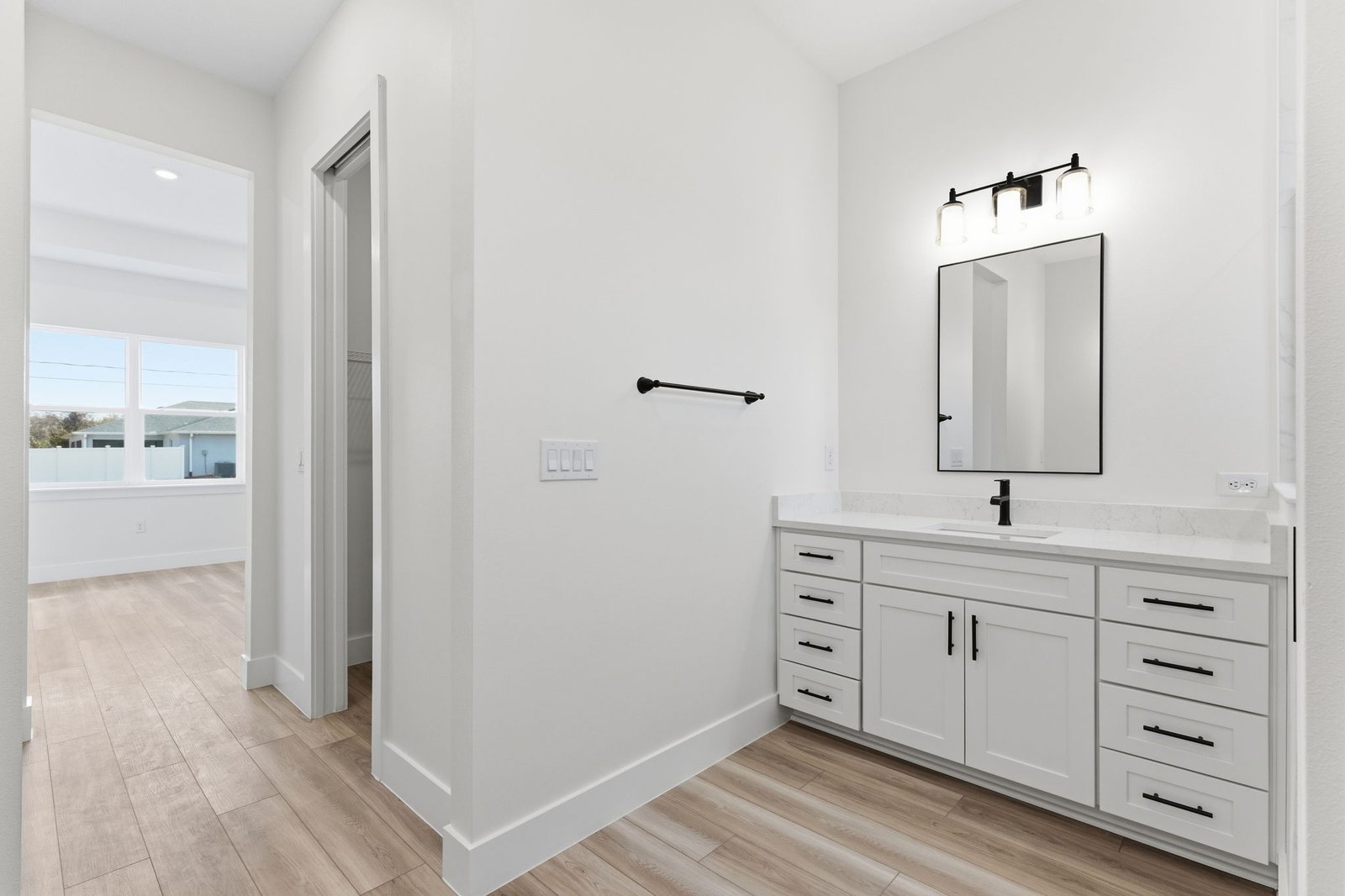 Bathroom vanity and finish details in a completed LINO home